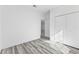 Spacious bedroom with grey flooring and a double door closet at 162 Nw 42Nd Pl, Ocala, FL 34475