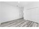 Simple bedroom with grey flooring and double door closet at 162 Nw 42Nd Pl, Ocala, FL 34475