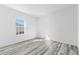 Well-lit bedroom featuring grey flooring and a window with natural light at 162 Nw 42Nd Pl, Ocala, FL 34475