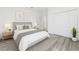 A serene bedroom featuring a full closet, soft lighting and minimalist decor at 162 Nw 42Nd Pl, Ocala, FL 34475