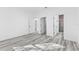 Bedroom with wood-look floors and access to bathroom and closet at 162 Nw 42Nd Pl, Ocala, FL 34475