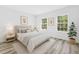 Inviting bedroom with two large windows, natural light, and complemented by minimalist decor at 162 Nw 42Nd Pl, Ocala, FL 34475