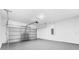 Attached garage with light grey epoxy flooring and automatic door at 162 Nw 42Nd Pl, Ocala, FL 34475