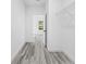 Bright hallway with wood-look floors and access to bedroom at 162 Nw 42Nd Pl, Ocala, FL 34475
