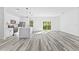 Modern kitchen with white cabinets, island, and stainless steel appliances at 162 Nw 42Nd Pl, Ocala, FL 34475