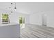 Modern kitchen with white cabinets, island, and pendant lighting at 162 Nw 42Nd Pl, Ocala, FL 34475