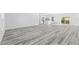 Open living area featuring wood-look floors and natural light at 162 Nw 42Nd Pl, Ocala, FL 34475