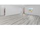 Open concept living area with gray flooring and natural light at 162 Nw 42Nd Pl, Ocala, FL 34475