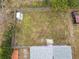Aerial view of house backyard, shed, and partially visible street at 164 Brad Cir, Winter Haven, FL 33880