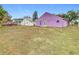Large backyard with a mostly flat lawn at 164 Brad Cir, Winter Haven, FL 33880
