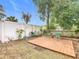 Backyard with a wooden deck and landscaping at 164 Brad Cir, Winter Haven, FL 33880