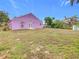 Large backyard with a mostly flat lawn at 164 Brad Cir, Winter Haven, FL 33880