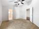 Spacious bedroom with ceiling fan and plush carpeting at 164 Brad Cir, Winter Haven, FL 33880