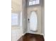 Front door entryway with wood floor and white door at 164 Brad Cir, Winter Haven, FL 33880