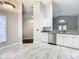 Modern kitchen with stainless steel appliances and light-grey cabinetry at 164 Brad Cir, Winter Haven, FL 33880