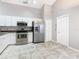 Kitchen with stainless steel appliances and white cabinets at 164 Brad Cir, Winter Haven, FL 33880