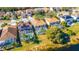 Aerial view of lakefront homes with solar panels at 1647 Bridgeview Cir, Orlando, FL 32824