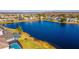 Aerial view of lakefront homes with solar panels at 1647 Bridgeview Cir, Orlando, FL 32824