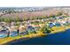 Aerial view of lakefront homes with solar panels at 1647 Bridgeview Cir, Orlando, FL 32824