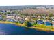 Aerial view of lakefront homes with solar panels at 1647 Bridgeview Cir, Orlando, FL 32824