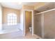 Bathroom with garden tub and shower at 1647 Bridgeview Cir, Orlando, FL 32824