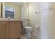 Small bathroom with toilet and sink at 1647 Bridgeview Cir, Orlando, FL 32824