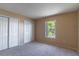 Spacious bedroom with double door closet and window at 1647 Bridgeview Cir, Orlando, FL 32824