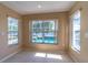 Dining area with serene pool view at 1647 Bridgeview Cir, Orlando, FL 32824
