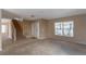 Bright entryway with staircase, neutral carpeting, and tiled flooring at 1647 Bridgeview Cir, Orlando, FL 32824