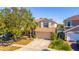 Two-story house with a welcoming front yard and driveway at 1647 Bridgeview Cir, Orlando, FL 32824