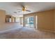 Bright living room with view of pool and kitchen at 1647 Bridgeview Cir, Orlando, FL 32824