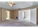 Main bedroom with ceiling fan and access to other rooms at 1647 Bridgeview Cir, Orlando, FL 32824