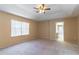 Main bedroom with ceiling fan and ensuite bathroom access at 1647 Bridgeview Cir, Orlando, FL 32824