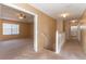 Upstairs hallway with carpet, leading to bedrooms and bathroom at 1647 Bridgeview Cir, Orlando, FL 32824