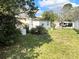Spacious backyard featuring a well-maintained lawn, perfect for outdoor activities and relaxation at 1960 Pinewood Ln, Mount Dora, FL 32757