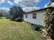 Well-maintained backyard with lush lawn and ladder providing space for outdoor activities at 1960 Pinewood Ln, Mount Dora, FL 32757