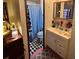 Bathroom with single vanity, shower, and tiled floor at 1960 Pinewood Ln, Mount Dora, FL 32757