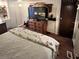 Main bedroom with king bed and built-in dresser at 1960 Pinewood Ln, Mount Dora, FL 32757