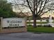 Welcome Home community entrance with a pond and fountain at 1960 Pinewood Ln, Mount Dora, FL 32757