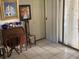 Inviting foyer with tile flooring and a desk adjacent to the patio entrance at 1960 Pinewood Ln, Mount Dora, FL 32757