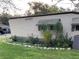 Landscaped exterior with rock border at 1960 Pinewood Ln, Mount Dora, FL 32757