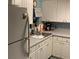 Bright kitchen features ample cabinetry and a double sink at 1960 Pinewood Ln, Mount Dora, FL 32757
