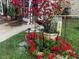 Landscaped area with flowers and garden decor at 1960 Pinewood Ln, Mount Dora, FL 32757