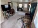 Bright living room with carpet, a day bed, and vintage decor at 1960 Pinewood Ln, Mount Dora, FL 32757