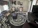 This living room boasts an area rug and neutral walls for a cozy feel at 1960 Pinewood Ln, Mount Dora, FL 32757