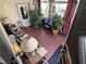 Bright sunroom with seating area, plants, and TV at 1960 Pinewood Ln, Mount Dora, FL 32757