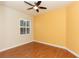 Bright bedroom with hardwood floors and a ceiling fan at 2077 Wembley Pl, Oviedo, FL 32765