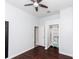 Bedroom with dark hardwood floors and a walk-in closet at 2077 Wembley Pl, Oviedo, FL 32765
