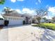 Spacious driveway and landscaped yard. Single-Gathering home with a two-car garage at 2077 Wembley Pl, Oviedo, FL 32765