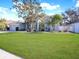 Single-story home with mature landscaping and a large front yard at 2077 Wembley Pl, Oviedo, FL 32765